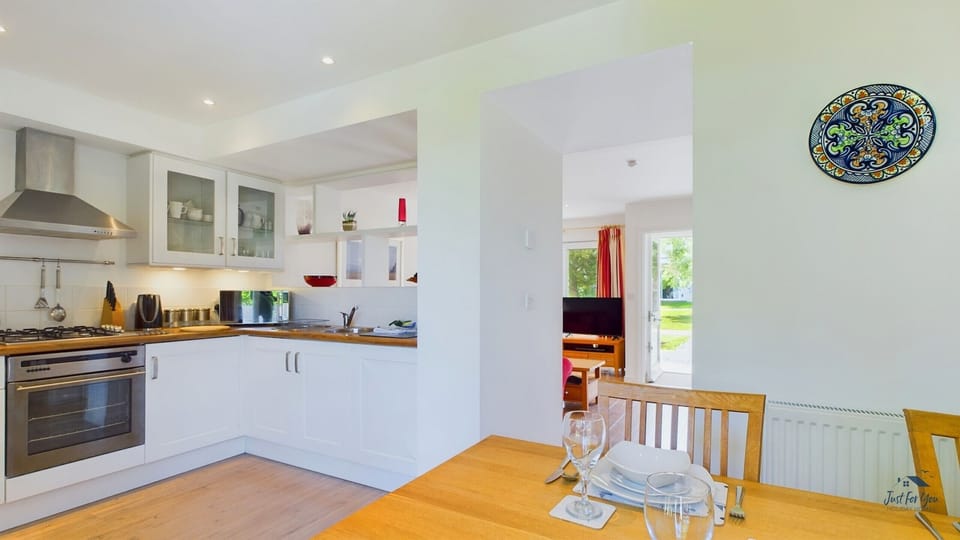 A high-spec, modern kitchen fully equipped with a range oven and fridge-freezer.
