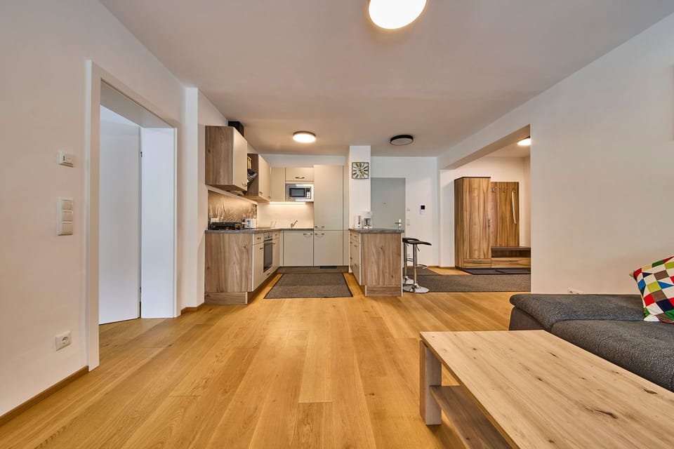 Classic Apartment, Balcony, Mountain View | Living area | 50-inch flat-screen TV with cable channels, heated floors