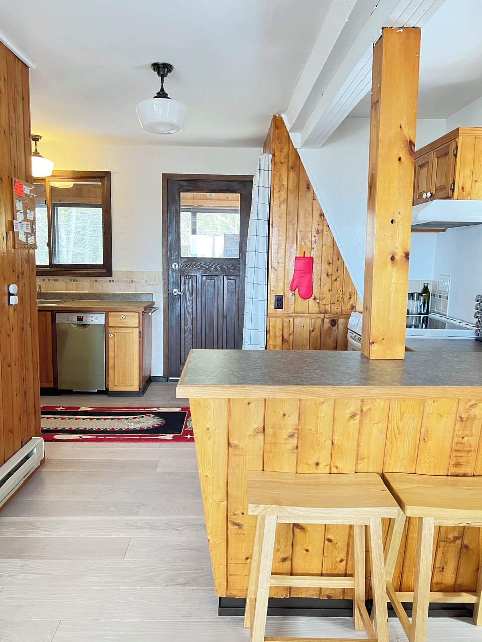Start your day at the cozy breakfast bar or prep meals with ease in this warm, wood-accented kitchen that flows into the heart of the home.