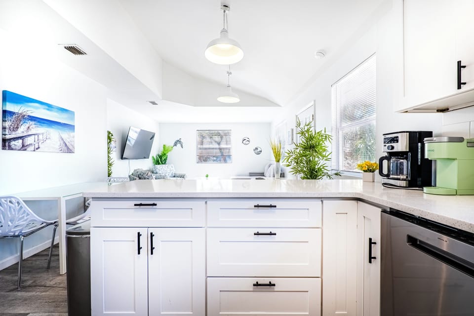 Kitchen overlooking Dining and Living Room