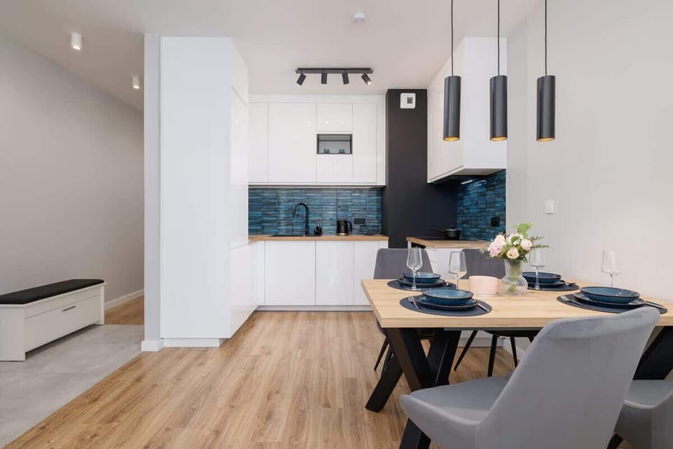 Bright kitchen with cooking utensils. 