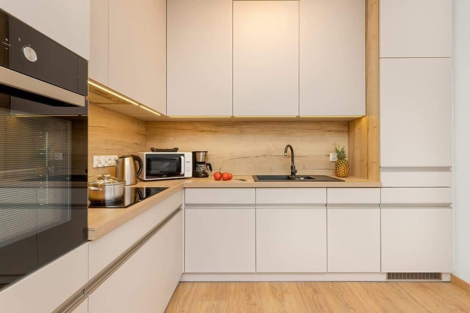 Cook and dine in style with the modern kitchenette and dining area.