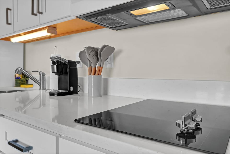 Coffee maker, Induction Cooktop, and basic kitchen utensils