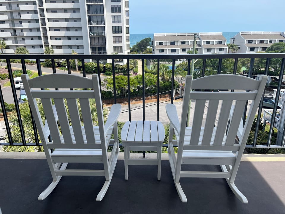 private balcony overlooking our saltwater pool