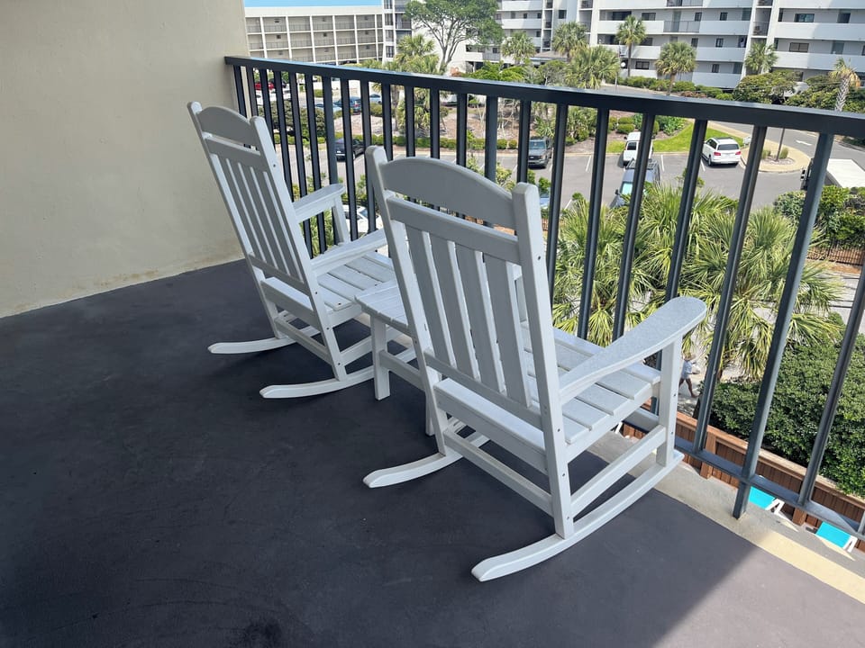 private balcony overlooking our saltwater pool