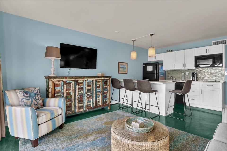 Unwind in your open-concept haven with coastal charm, featuring modern kitchen, cozy seating, and thoughtful touches throughout.