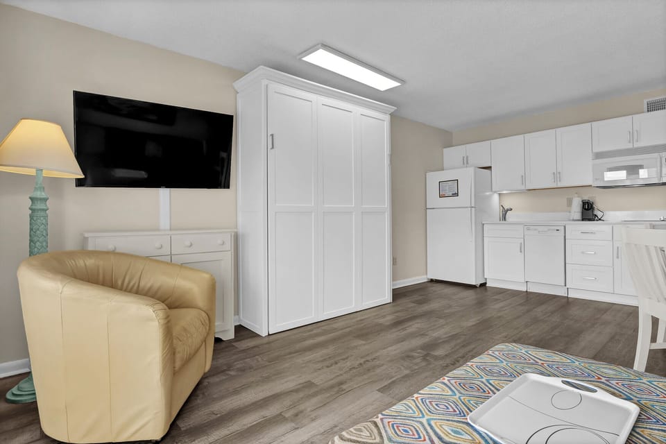 Your spacious studio features a full kitchen, comfy seating, and smart storage solutions for the perfect home-away-from-home experience.