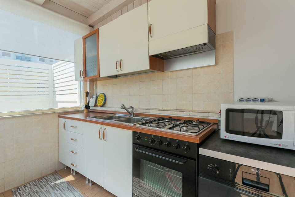 Apartment | Private kitchen | Espresso maker, dining tables