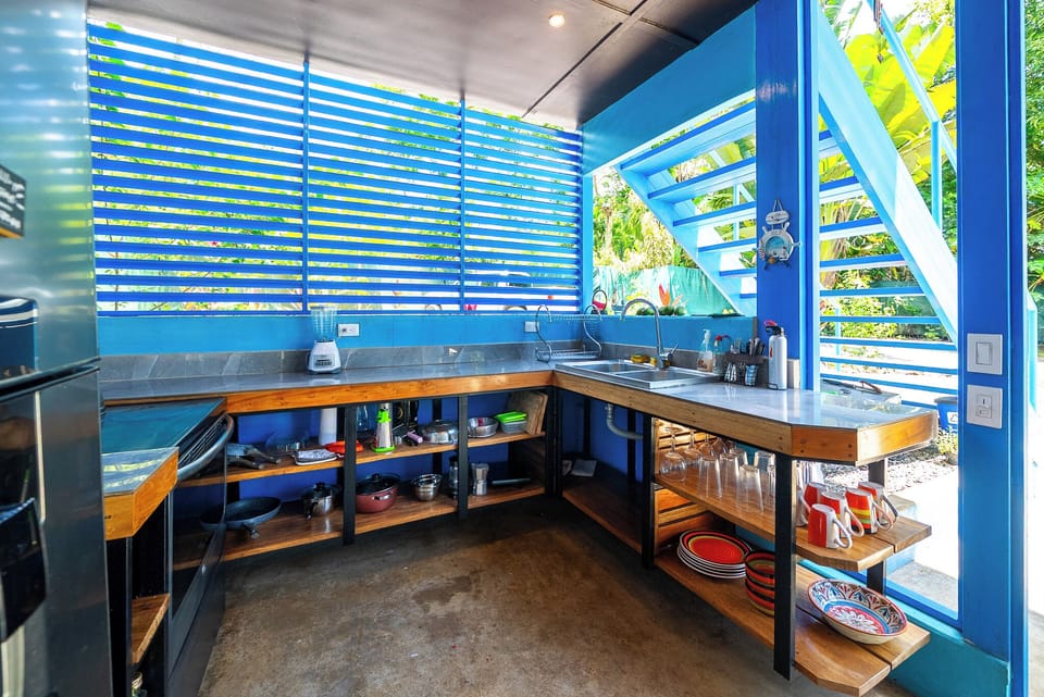 fully stocked kitchen with lots of natural light and ocean view. ceiling fan.