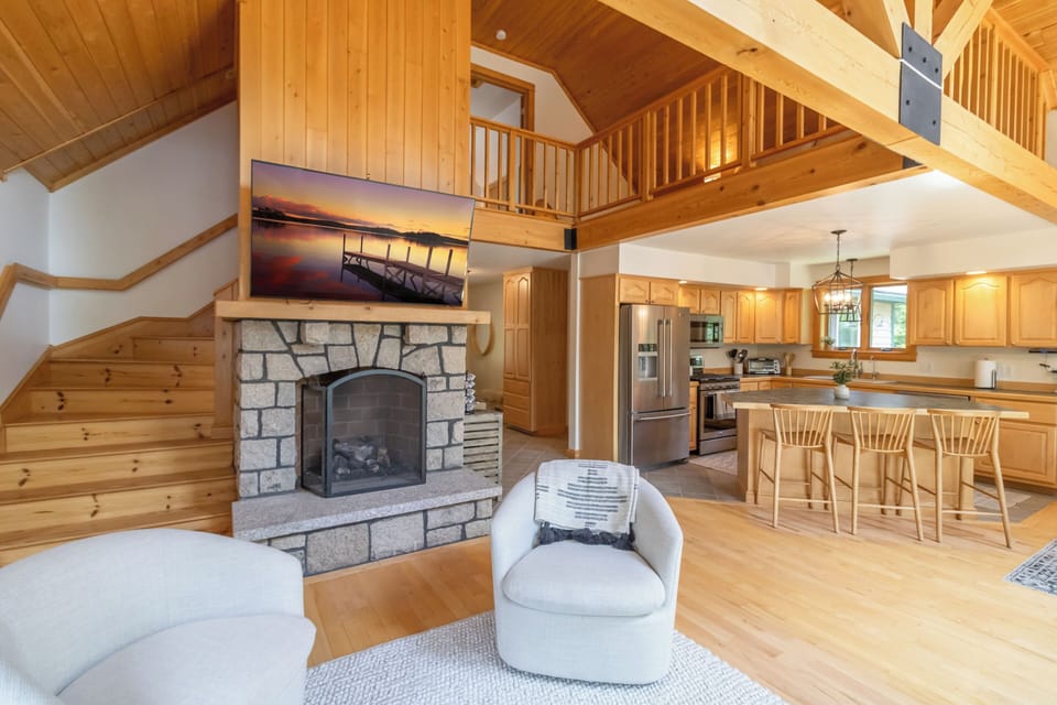 A spiral staircase behind the fireplace leads up to the loft and loft bedroom