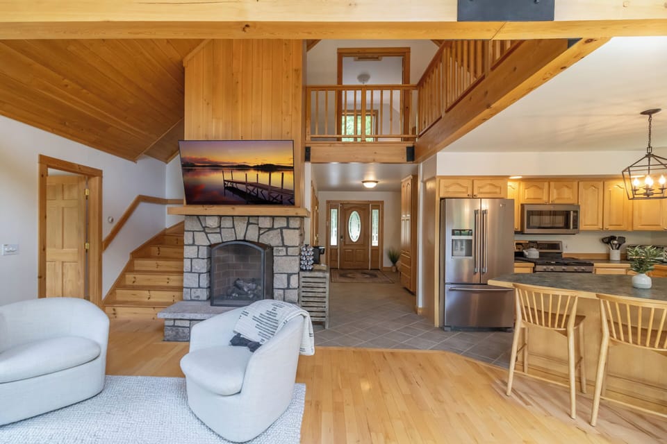 Inviting and airy open floorplan with fans in each high ceiling