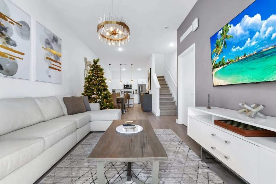 The living room was cozy and inviting, with a plush sofa nestled between a pair of elegant armchairs.