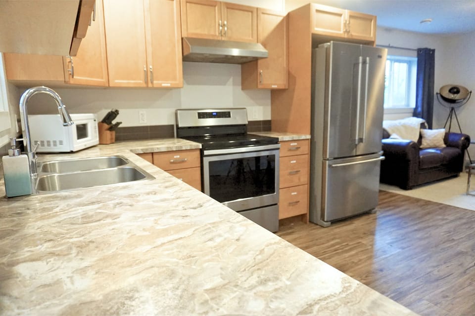 Fully stocked kitchen, including coffee maker, air fryer and other appliances.
