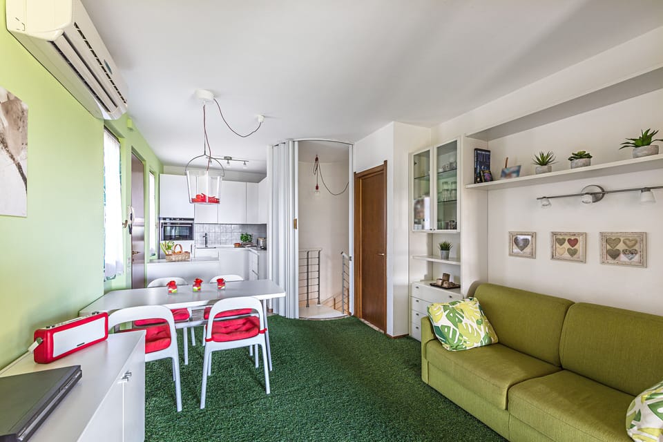 Apartment, Garden View | Living area | 35-cm TV with digital channels