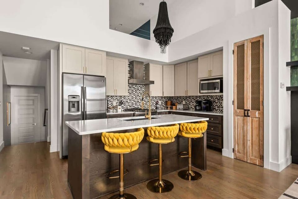 Full kitchen with island featuring bar seating