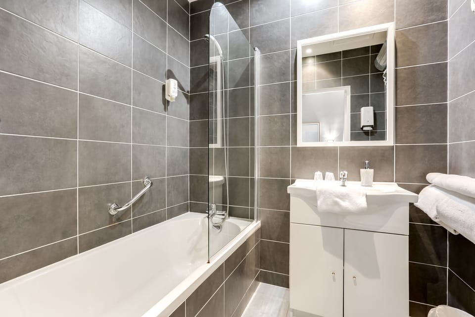 Quadruple Room (Suite for 4 per) | Bathroom | Hair dryer, towels