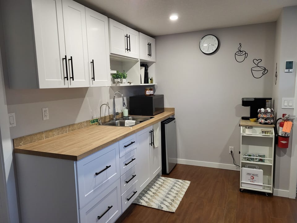 kitchenette includes microwave, mini fridge, electric fry pan, and rice cooker. 