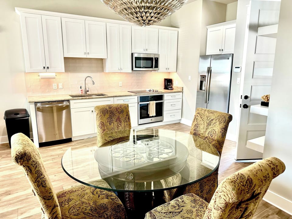 Modern Kitchen with stainless steel appliances & dining area 
