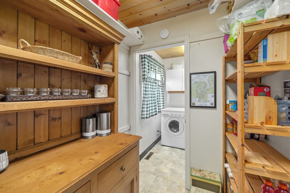 Pantry and full size washer and dryer in the laundry space