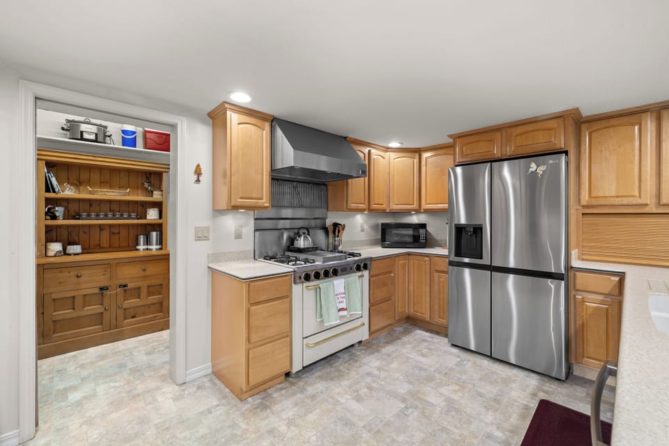 Enjoy a well stocked kitchen with stainless steel appliances and a gas range