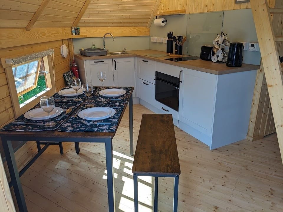 Premium Cabin, Private Bathroom, Courtyard View (Sleeps 2-6 - Mezzanine) | Private kitchen | Full-size fridge, microwave, oven, stovetop