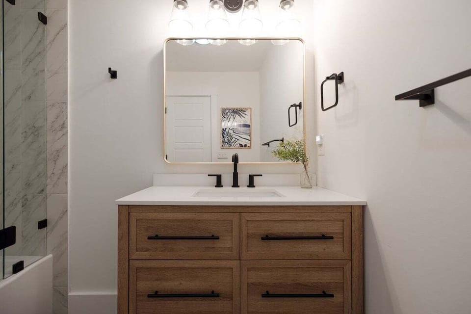 Spa-inspired ensuite bathroom with a spacious walk-in shower and upscale finishes creates the perfect private retreat.
