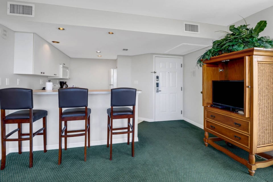 A TV in the main living area has community provided DirecTV.