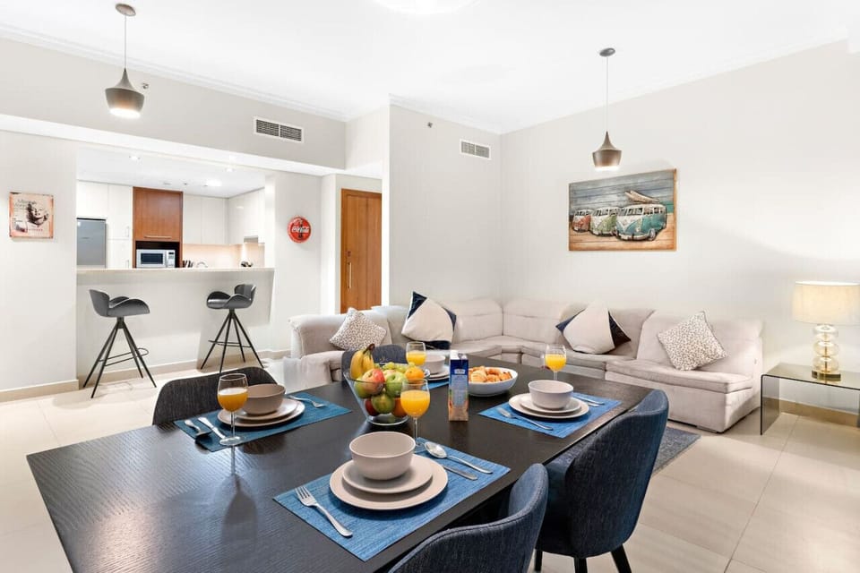 Living Room: Enjoy vibrant gatherings by the modern dining table and chic lounge area!