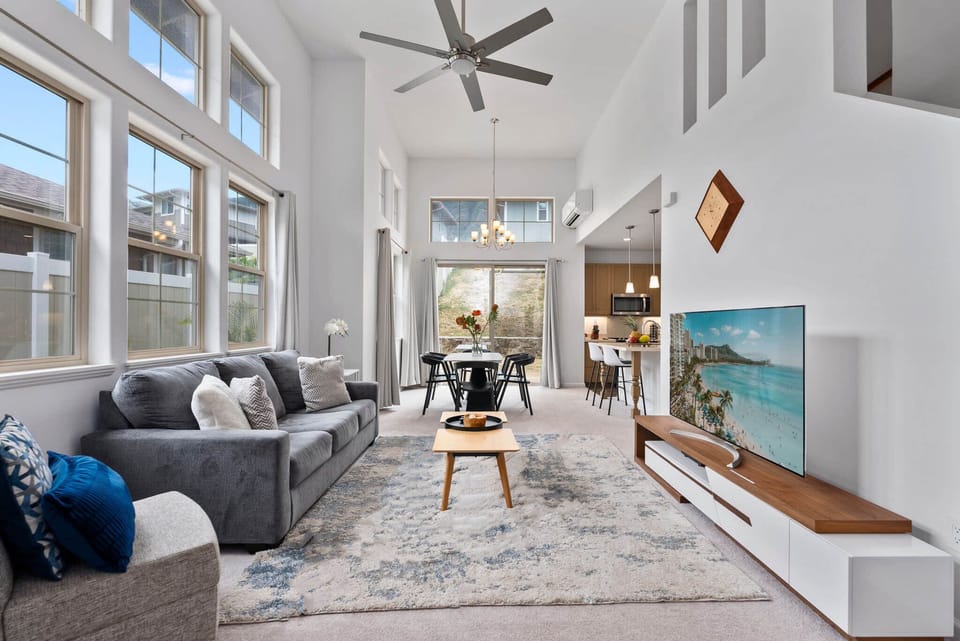 Bright and airy living room with high ceilings and modern comfort