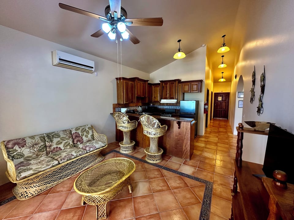 Two BDR upper The living room with cable TV and breakfast bar