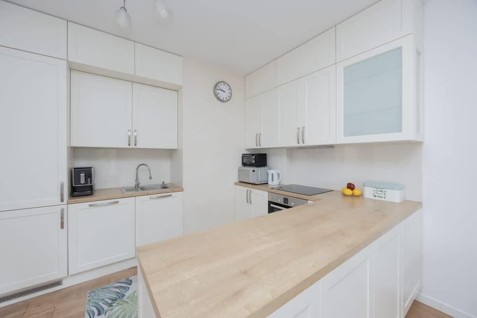 Cook and dine in style with the modern kitchenette and dining area.