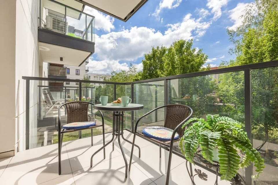 The balcony provides a tranquil spot for enjoying a book. 