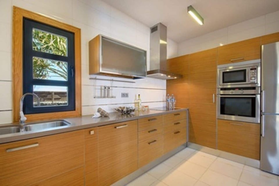 Villa | Private kitchen | Fridge, microwave, oven, stovetop