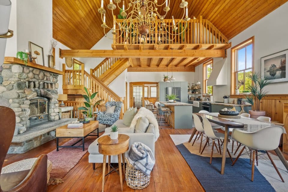 Grand living room with original hardwood floors, wood-burning fireplace, mountain views & other amazing amenities just waiting to be explored.