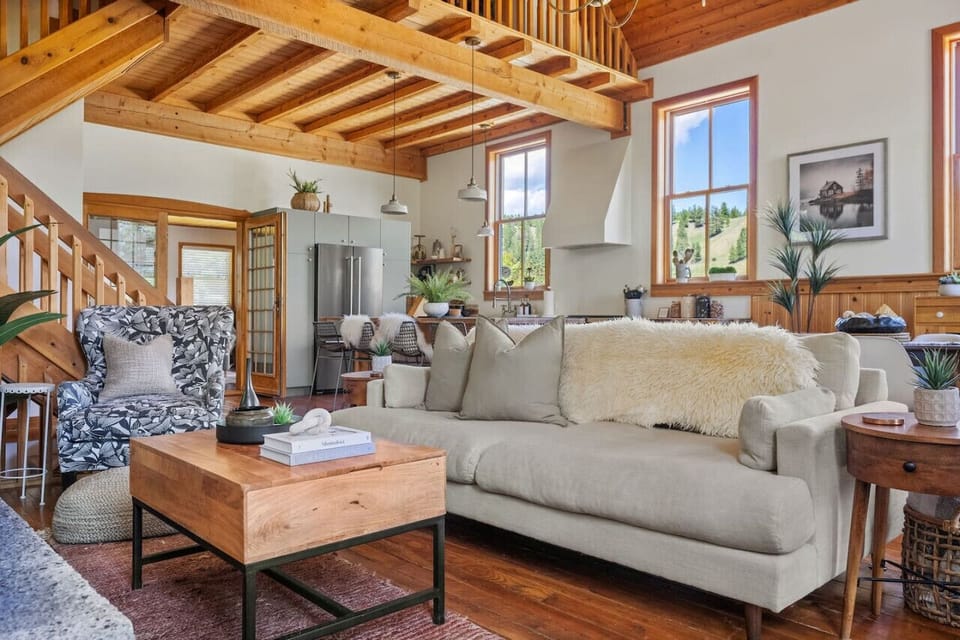 Grand living room with original hardwood floors, wood-burning fireplace, mountain views & other amazing amenities just waiting to be explored.