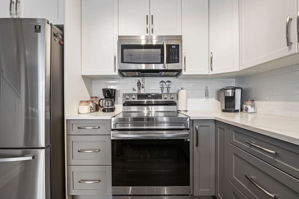 Full kitchen with island seating, Keurig & drip coffee maker, blender & more.
