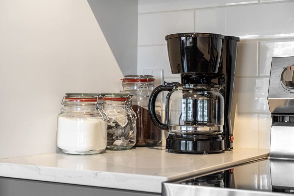 Full kitchen with island seating, Keurig & drip coffee maker, blender & more.