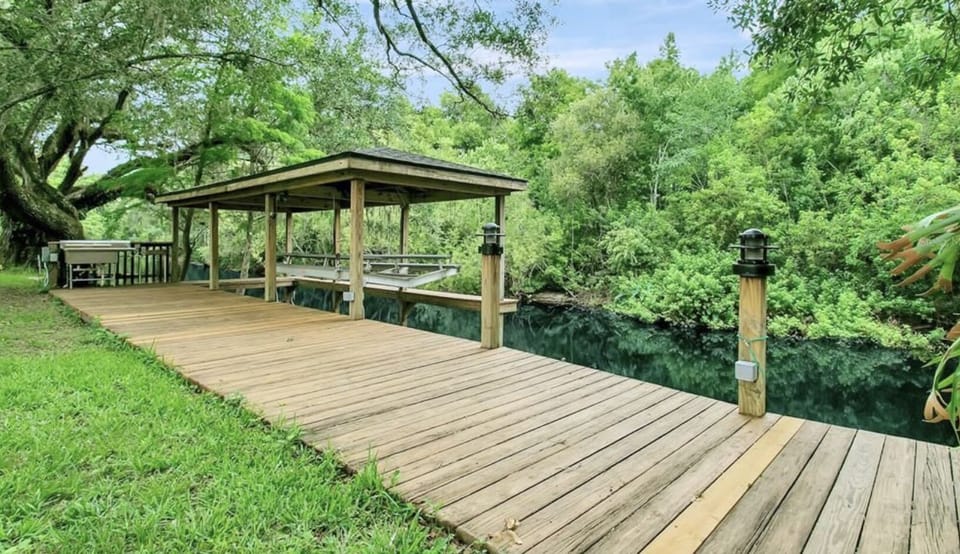 Boat house and deck in backyard