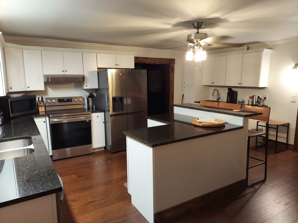 The newly renovated kitchen is spacious for your family to cook together.