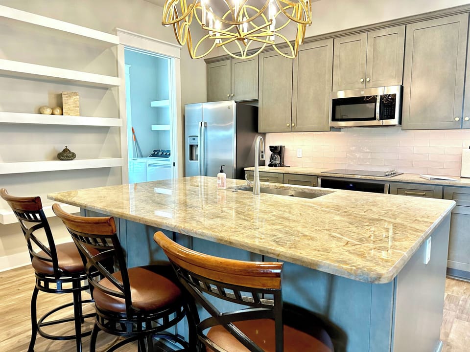 Modern Kitchen with stainless steel appliances and island seating