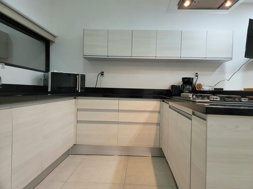 Full kitchen with 5 burner gas range.