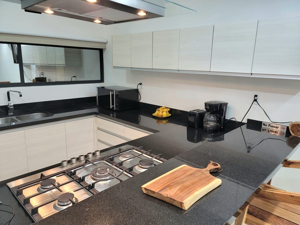 Full kitchen with 5 burner gas range.