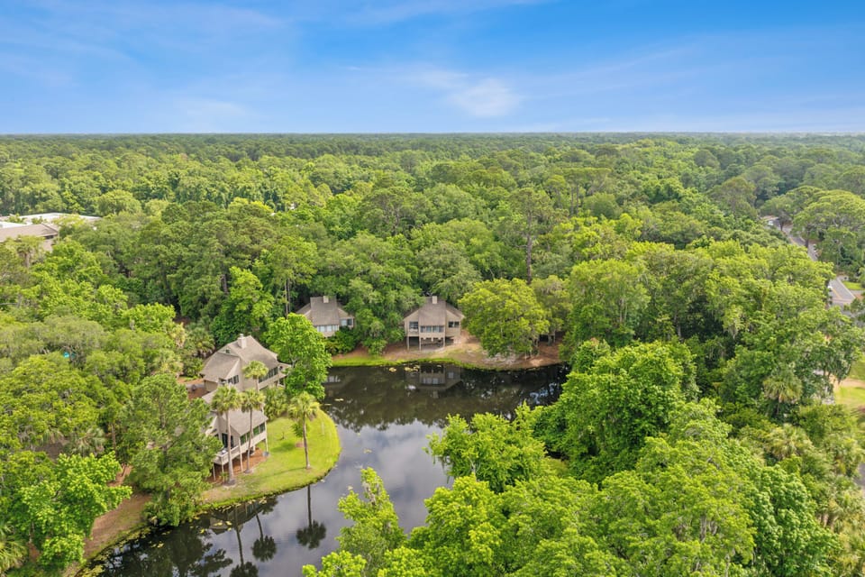 Immerse yourself in the natural beauty of Sea Pines with long lagoon views and lush greenery all around.