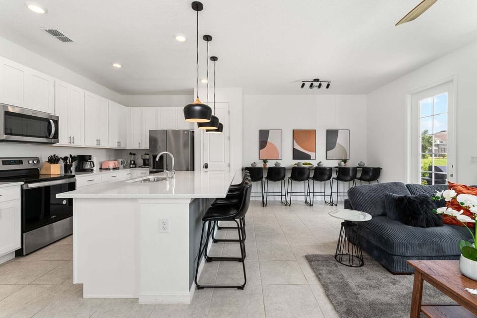 The living room, dining area and kitchen perfectly integrate into one ambience, ideal for socializing during the holidays.