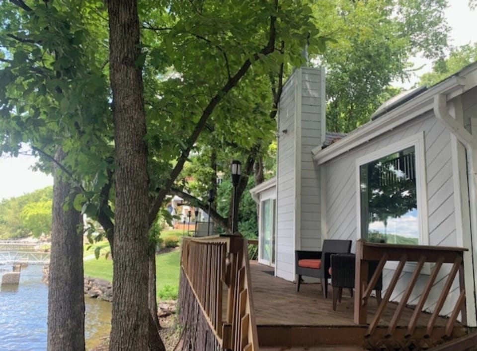 Large trees provide shade while enjoying the deck.