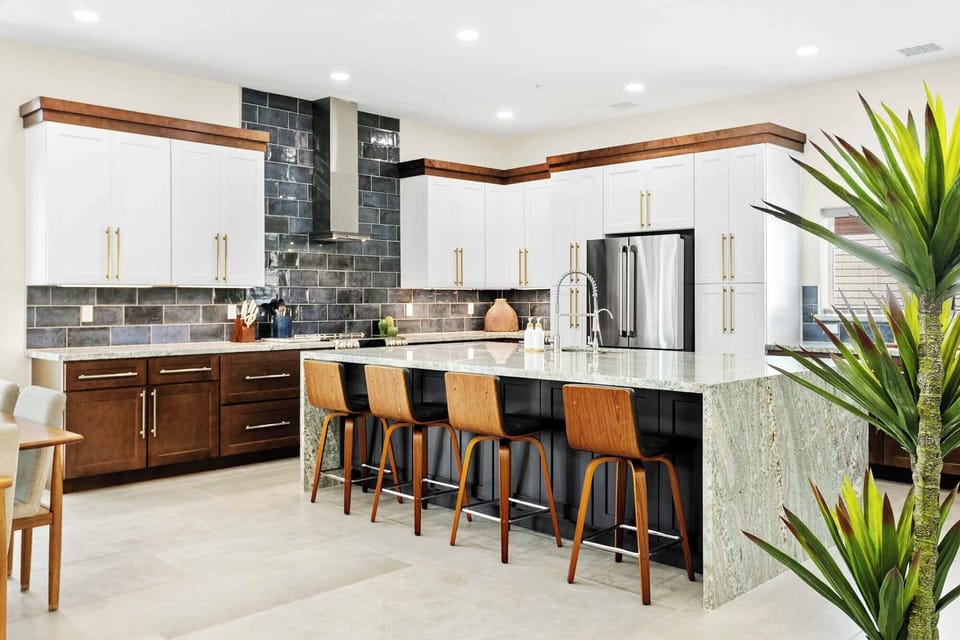 Gourmet kitchen with large island and stainless steel appliances
