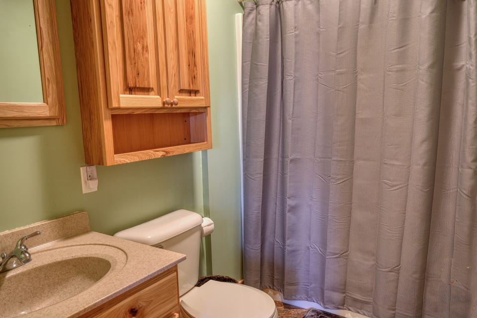 Upstairs bathroom with tub/shower.