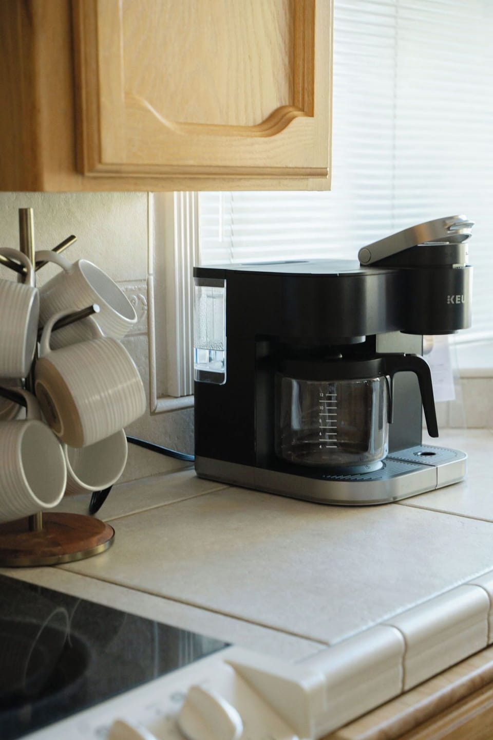 GLASS CUPS, COFFEE MUGS,  GROUND COFFEE MAKER AND KEURIG 