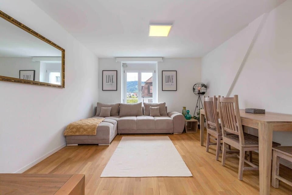 Living room with a sofa bed that sleeps up to 2 pax (and has a door for privacy).

Sofa bed can be prepared on request (additional charge applies). 

For group of 5/6, sofa bed is included in the rental price.