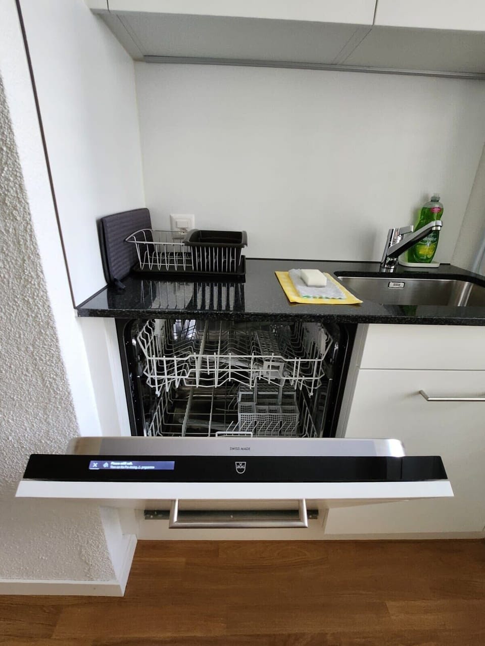 Apartment is equipped with a V-Zug dishwasher in the kitchen.